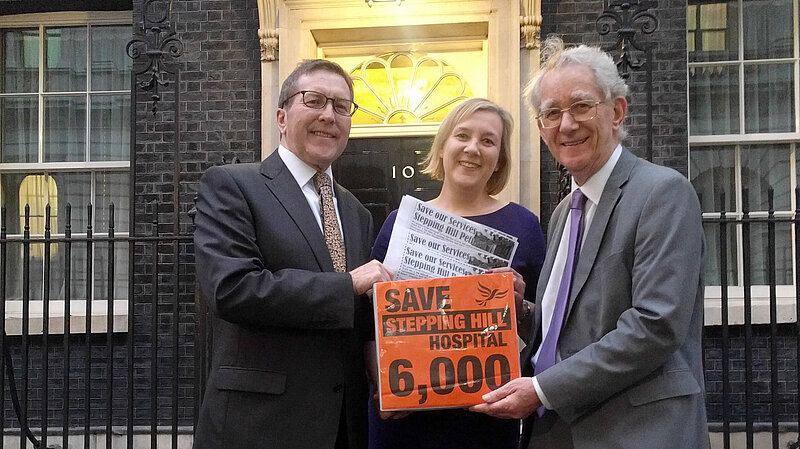 Lisa Smart with Mark Hunter and Andrew Stunell presenting over 6,000 signature at Downing Street