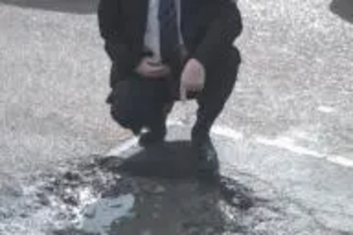 Tom McNeice with pothole