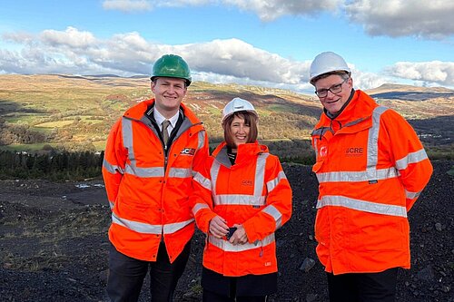 David Chadwick MP & Jane Dodds MS standing in front of a disused coal mine at the Global Centre for Rail Excellence site