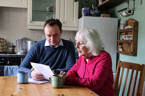 Danny looking at energy bill