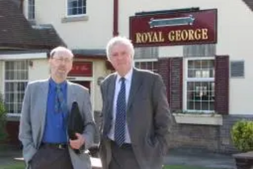 Councillors David Down and John Shipley outside the Royal George pub in Parklands Ward