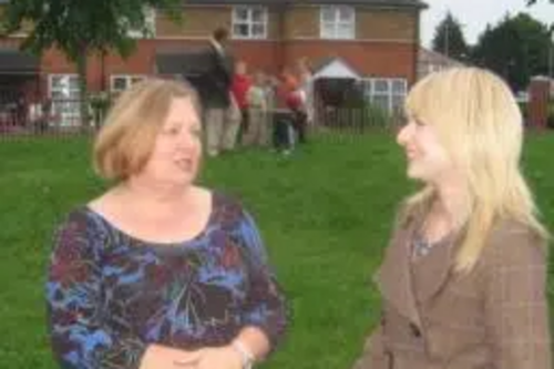 Jude Deakin talking to local resident