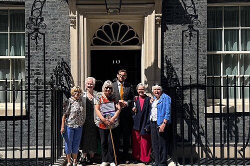The Horspath Post Office Hub delivering their petition to 10 Downing Street