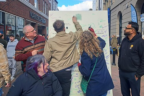 Ian Roome and Local Lib Dems campaign with Giant Letter in Barnstaple High Street