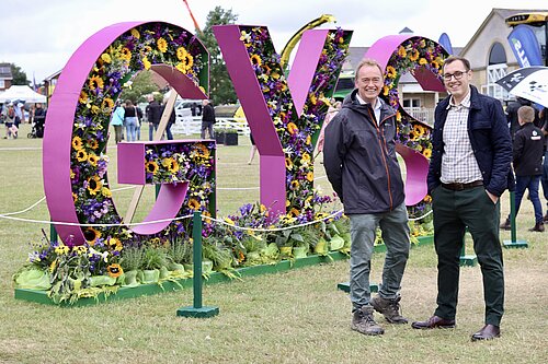 Tom Gordon with Tim Farron MP in front of a large 3D sign reading "GYS" at the Great Yorkshire Show in Harrogate