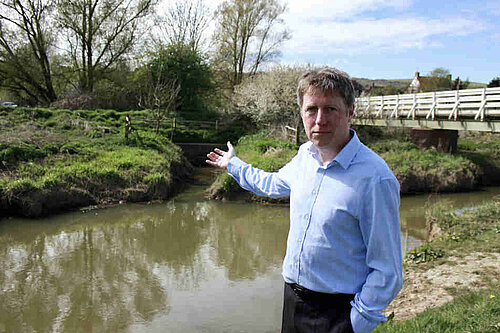 On a fine day James points rather disconsolately towards the brown waters of the Cuckmere