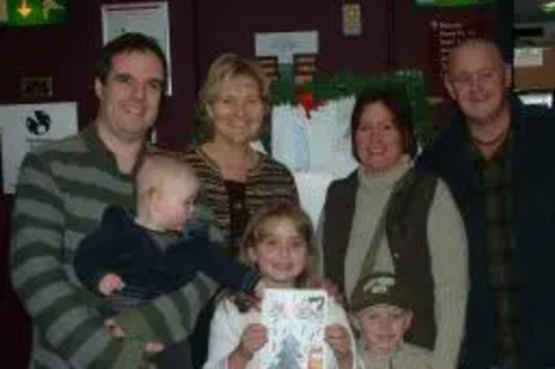 Matthew Taylor and Terrye Teverson congratulate Danielle with her brother Ozzy and Mum and Dad Maria and Harry Burns. Matthew is holding his son Jacob Taylor