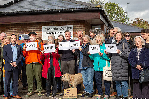 James MacCleary, town councillor Kevin West and others, including a dog, outside the Phoenix Centre, holding cards that say "Save our Phoenix Centre"