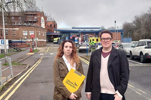 Liberal Democrat candidates Tara Copeland and Josh Hadley stood outside Whipps Cross Hospital