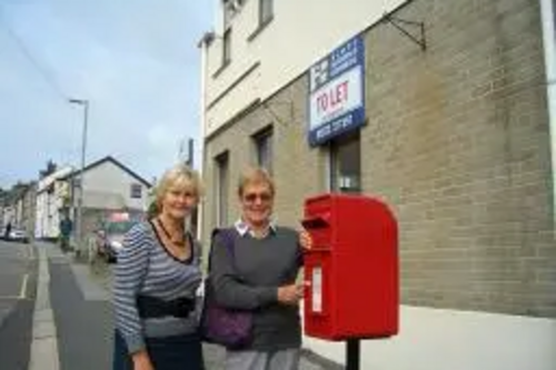 Terrye Teverson outside the old Kenwyn Post Office with local campaigner Anne Pengelly