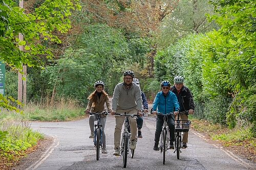 Freddie cycling in Goring with local Councillors and residents