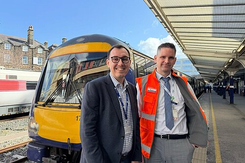 Tom Gordon stood in front of a train at Harrogate station