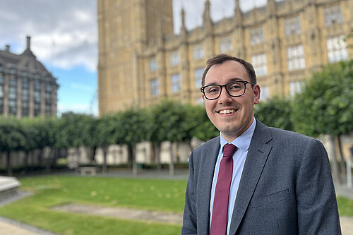 Tom Gordon stood outside the Houses of Parliament 