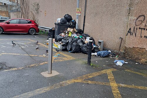 Flytipping with loads of rubbish in car park area