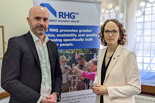 Alison Bennett MP infront of Real Homes Group Roller Banner
