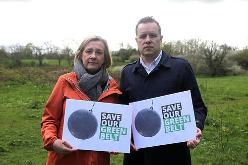 Lisa Smart MP and Tom Morrison MP hold up save our green belt signs