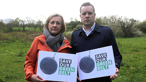 Lisa Smart MP and Tom Morrison MP hold up save our green belt signs