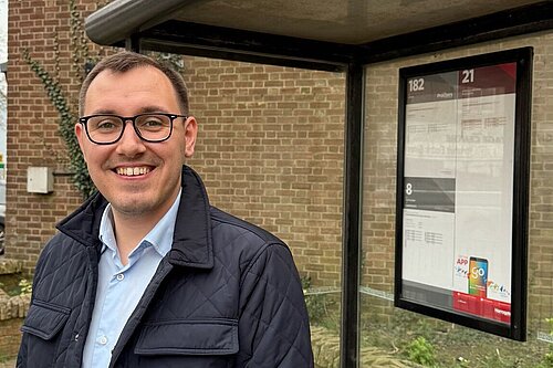Tom Gordon stood at a bus stop in Harrogate 