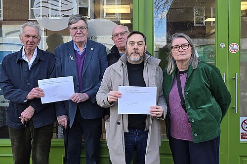 Lewes LibDem councillors Edwina Livesey, Kevin West, John Lamb, Richard Burrows and Andrew Norris with a petition they are about to hand in to have the Tourist Information Office in Lewes High Street reopened