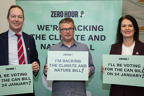 (Left to right) Richard Foord MP, Hugh Fearnley-Whittingstall, and Monica Harding MP holding signs stating their support for the Climate and Nature (CAN) Bill
