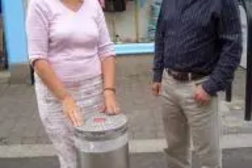 Terrye Teverson inspects Falmouth’s new traffic bollard with Chris Smith of Falmouth Town Forum