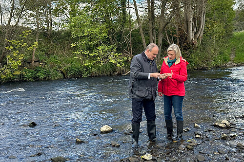 Ed Davey and Lisa Smart testing water quality in the Rover Goyt