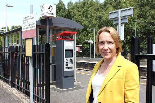 Helen Morgan at a ticket machine at Whitchurch Station