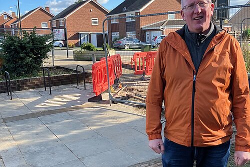 Councillor Fenton by the pavement repair works compound