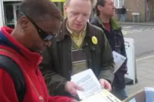 Stephen Robinson talking to passer-by in Moulsham Street