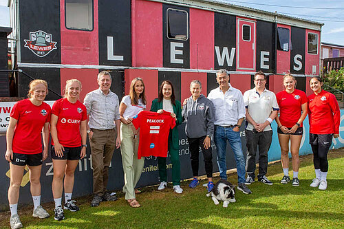 James with sports minister Stephanie Peacock and representatives of lewes FC women's team.
