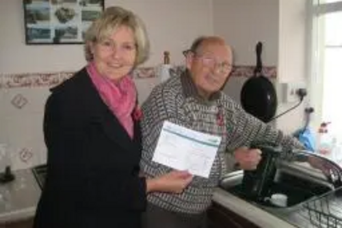 Terrye Teverson with Mr Paterson in his home