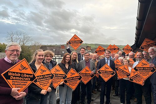 Photo of activists at the launch with Glyn in the centre and Lib Dem Diamonds
