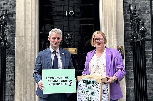 Holding the Climate and Nature Bill Petition outside Number 10