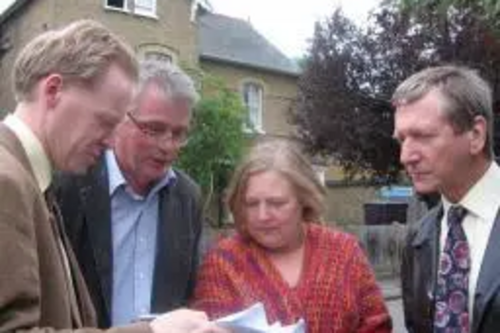 Maltese Road resident Bob Huntington in front of Courtman House, discussing its future with Marconi Councillors Jude Deakin and Graham Pooley (right), and Chelmsford Parliamentary Candidate Stephen Robinson