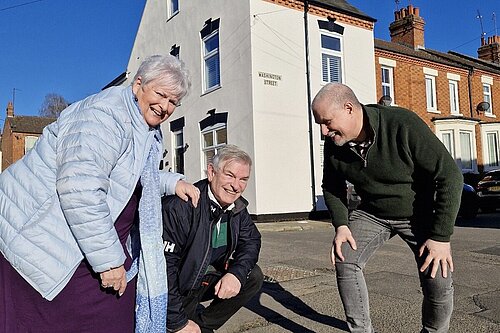 West Northamptonshire Lib Dems, standing next to a large pothole