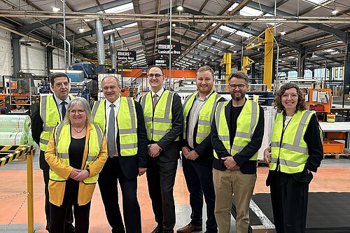 Group shot of the visitors to the Miers Factory