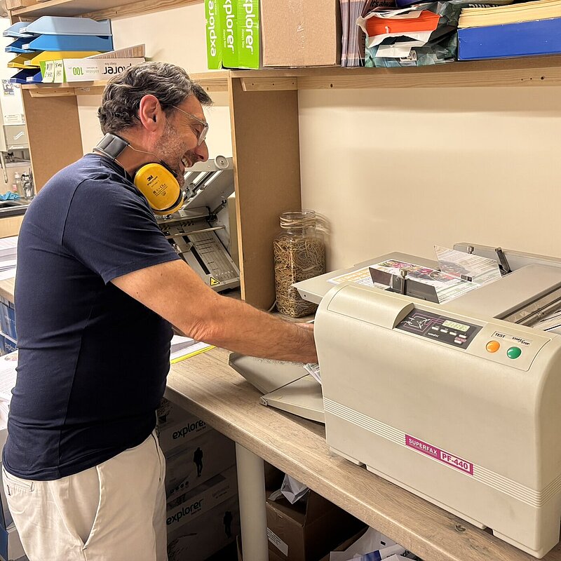 Jeff using the folding machine