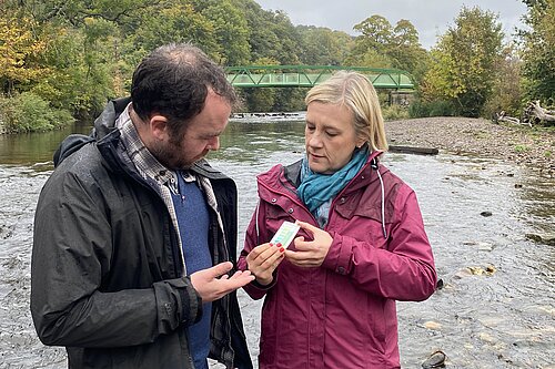 Lisa Smart with Councillor Mark Roberts testing the River Goyt at Chadkirk