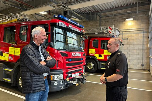 John Milne with firefighter