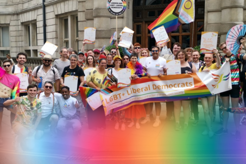 The LGBT+ Liberal Democrats with banners and flags