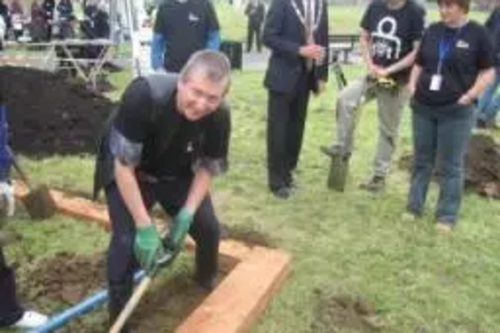 Graham Pooley digs out a trench for the new garden