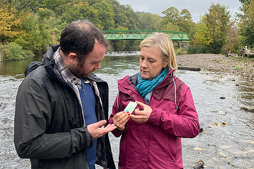 Lisa Smart and Mark Roberts testing water quality in the Rover Goyt