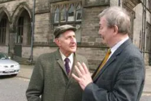 Councillor Alan Taylor discusses Lib Dem policies with a local resident.